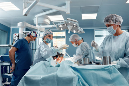 Team surgeon at work in operating room.