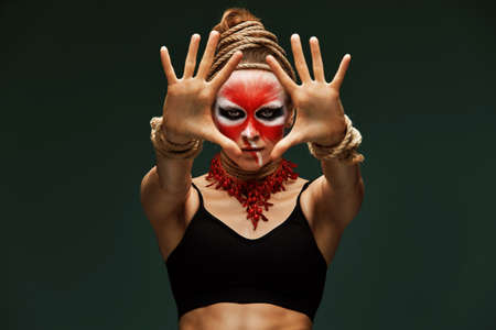 fashion portrait of pretty young woman with creative make up like a animal, fashion victim. Animal flowの写真素材