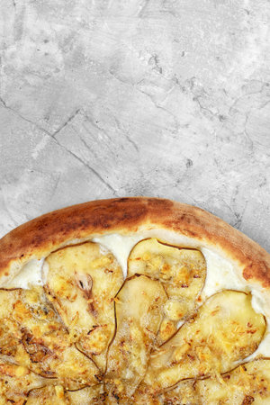 Pizza with pear, gorgonzola and on stone background. Top view.の写真素材