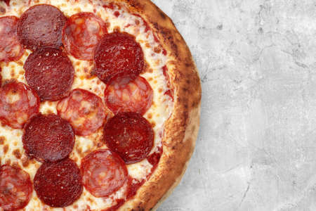 Homemade cheese pizza with salami, delicious pizza with cheddar. pepperoni pizzaの写真素材