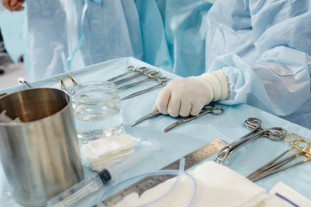 scrub nurse preparing medical instruments for operation