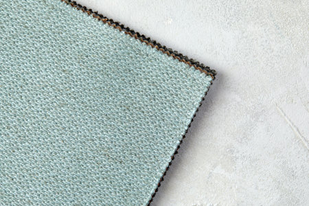 Knitted texture. Texture of jacquard fabric with blue geometric pattern. Crochet mosaic pattern.
