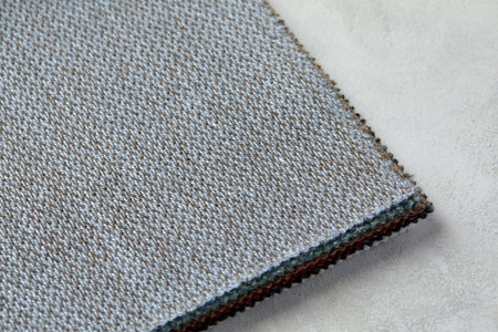 Knitted texture. Texture of jacquard fabric with gray pattern. Crochet mosaic pattern.の写真素材