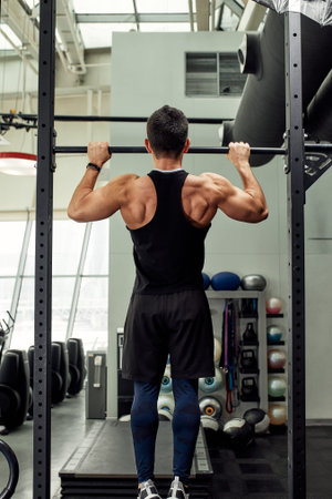 Pain during exercise, work with his own weight, the athlete does exercises on the uneven bars...