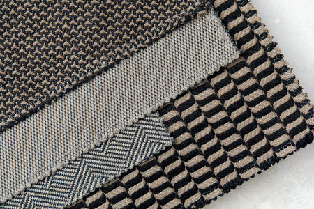 The background consists of several types of colored tiles with different patterns on gray tone