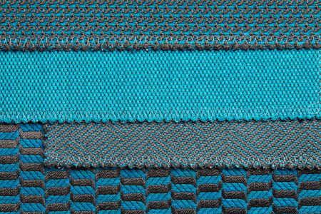 The background consists of several types of colored tiles with different patterns on blue tone