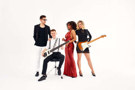 Young international musicians, a band performing. The concept of music, hobby, festival. Inspiration creativity.の写真素材