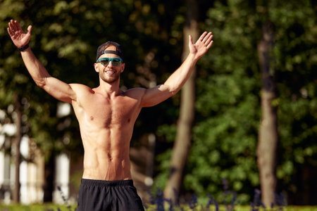 Athletic man running and doing functional workout outdoors - Sportive adult male with sportswear training in a cityの写真素材