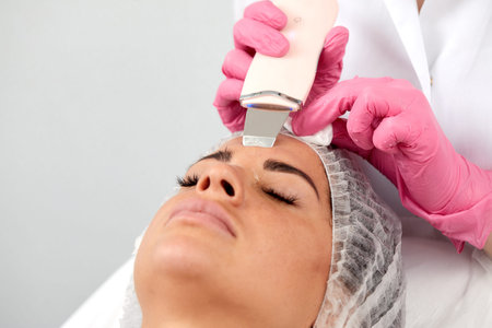 Skin Care. Close-up Of Beautiful Woman Receiving Ultrasound Cavitation Facial Peeling. Ultrasonic...