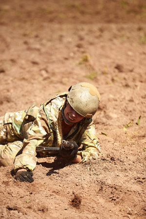Special forces soldier with weapon take part in military maneuver. War, army, technology and people...