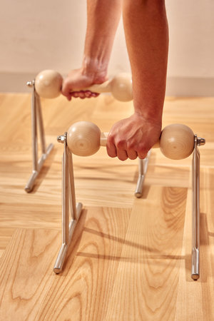 Pilates reformer workout exercises man at gym indoor.
