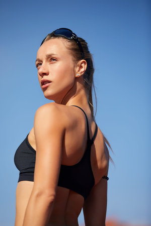 Portrait of a beautiful woman resting after run on stadiumの写真素材