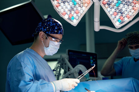 Modern equipment in operating room. Team surgeon at work in operating room. Surgeon in operating...