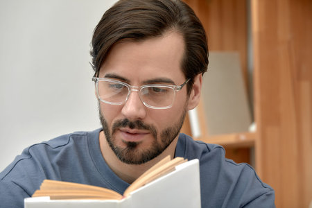Portrait of a stylish successful young man in glasses, young brunette businessman in glasses,...