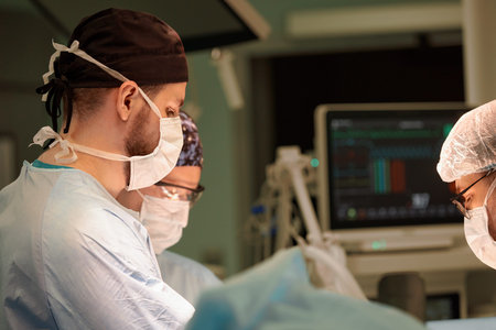 Faces of the team of surgeons, operation, modern surgery, light of operating lamps