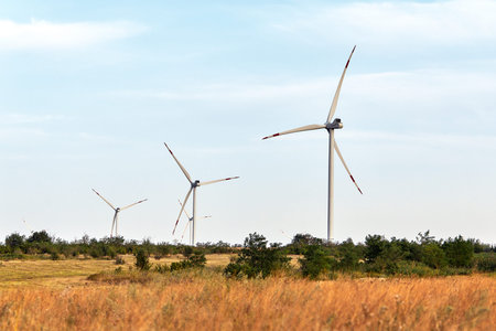 Wind turbine, alternative energy, wind energy, one windmill in a field in the mountains, top view of...
