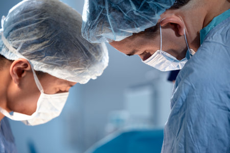 International team of surgeons in the operating room during the operation. Modern medicine, international medical workers during a complex operation, modern medicine.の写真素材