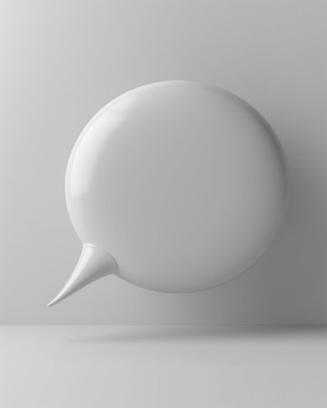 Sleek and Stylish White 3D Chat Bubble on a Subtle Grey Canvasの素材