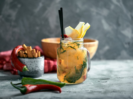 Summer lemonade pear with pepper. Refreshing summer drink with ice. Real concept, cocktail workspace. Food concept, food style, Copy space, food advertising for magazines and social networks.の写真素材