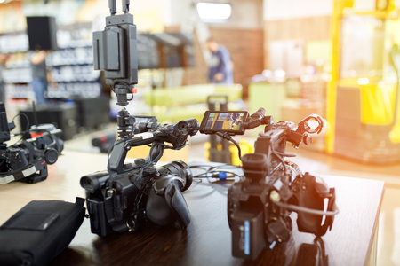 Behind the scenes of filming movies and video products, setting up equipment for shooting video and sound. The concept of producing video content for social networks, TV and blogs.の写真素材