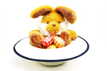 Easter bunny with eggs in flying saucerの写真素材
