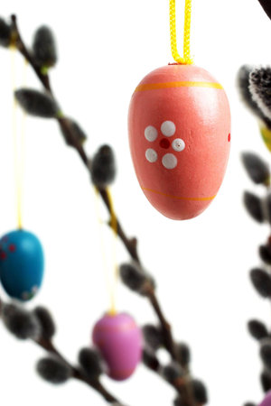 Easter eggs hanging from willow branches