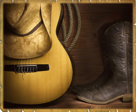 Country music background with guitar and cowboy clothesの写真素材