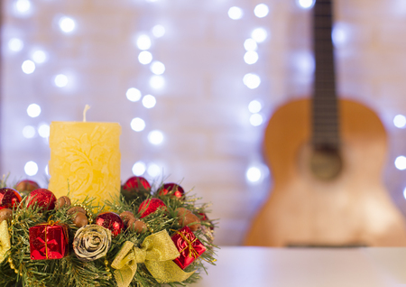 Christmas card for text with guitar and holiday christmas wreath and candleの写真素材