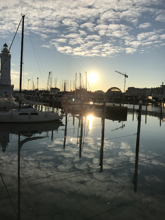 A beautiful sunset on the waters of the harborのeditorial素材