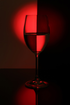 wine glass lighted red lightの写真素材