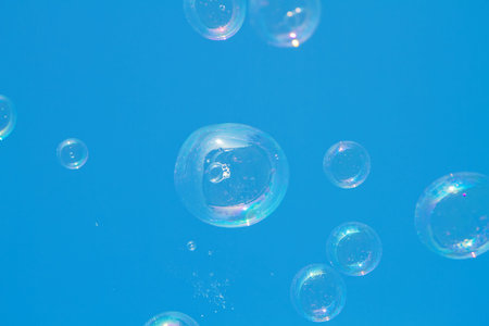 Many soap bubbles in blue