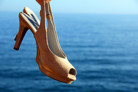 Shoes in front of the seaの写真素材