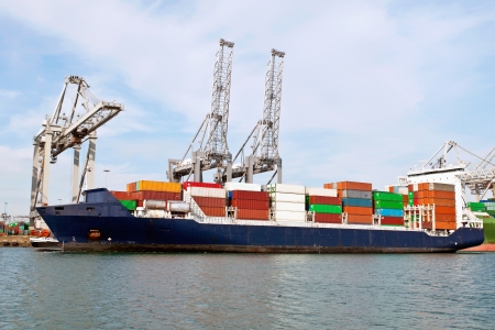 container ship in the harbor of rotterdam netherlandsの写真素材