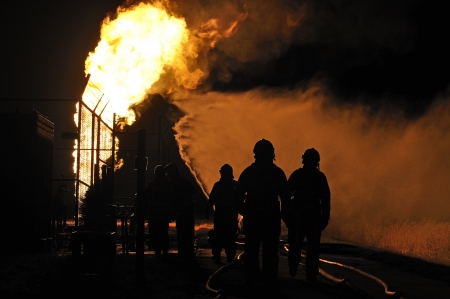 firefighters in action after a gas explosion の写真素材