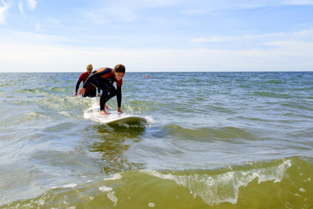 young girl have surf lessons on vacation