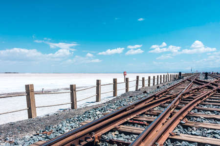 Rail pass through the salt fieldの写真素材