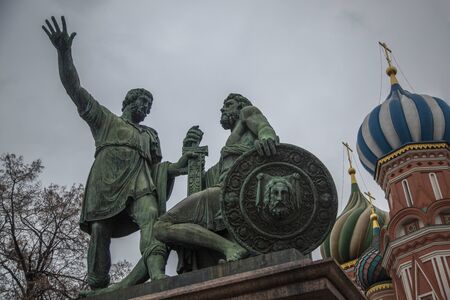 MOSCOW, RUSSIA - FEBRUARY 15, 2014: Monument to Minin and Pozharsky and St. Basil Cathedral on Red square in Moscowのeditorial素材