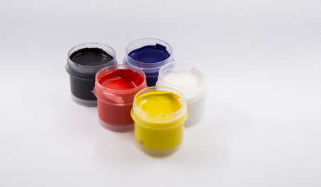 five cans of paints gouache on white backgroundの写真素材
