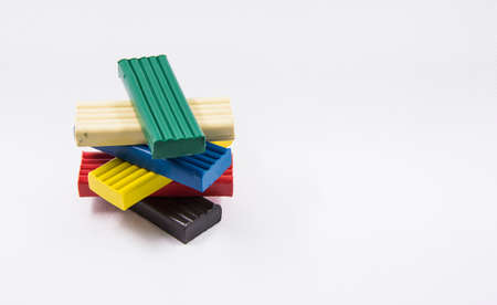 a pyramid of children's plasticine on a white backgroundの写真素材