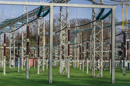 power plant with isolation objects in front of treesの写真素材