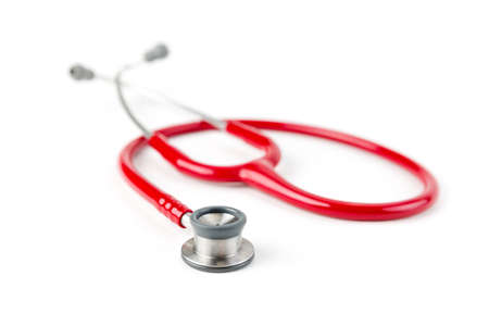 Red medical stetoskop isolated on a white background. Studio shot. Front View. Shallow depth of field.の写真素材