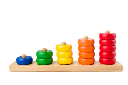 Colorful wooden children toy scores from one to five figures of the colored rings isolated on a white background. Studio shot.の写真素材