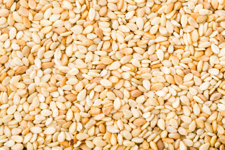 Closeup of white sesame seeds background. Top view. Studio shot.の写真素材