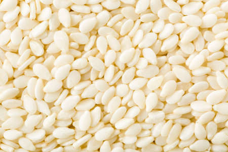 White peeled sesame seeds close up, background, texture, top viewの写真素材