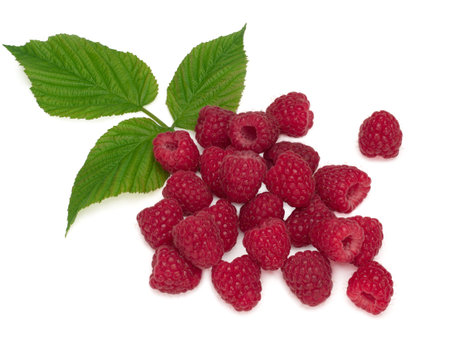 Raspberry with leaves isolated on a white background.
