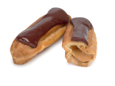 Choux cakes stuffed with condensed milk on white background