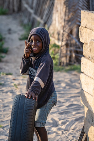 Ghana boy posing with his car tire in a small village in Ghana called Keta 2020 November 11のeditorial素材