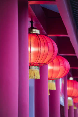 Chinese lamps with lighting hang in the ceiling of a Chinese building.の写真素材