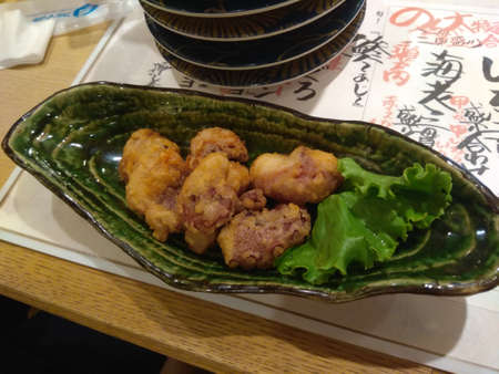 crispy fried octopus in a japanese restaurantの写真素材