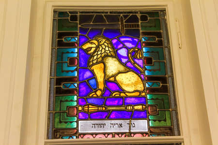 Stained glass window depicting a golden lionの写真素材